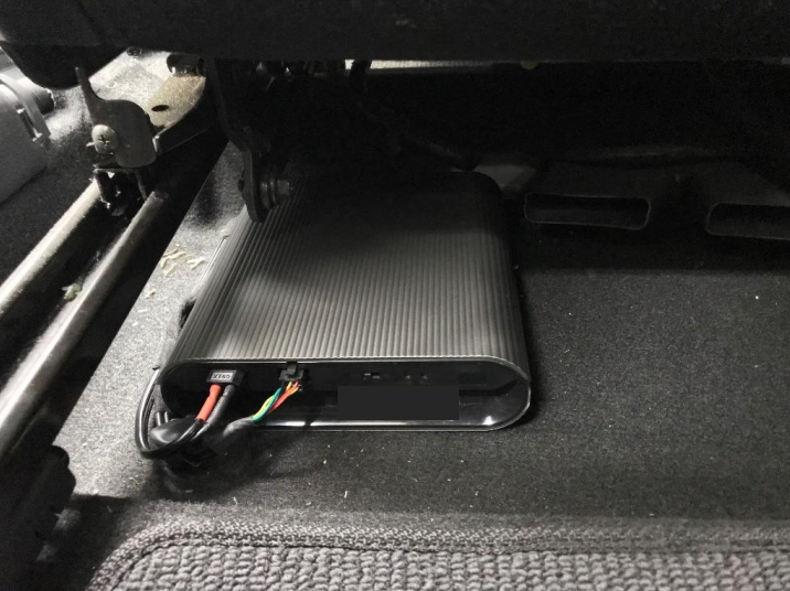 THINKWARE iVolt Mini external battery pack installed under driver seat