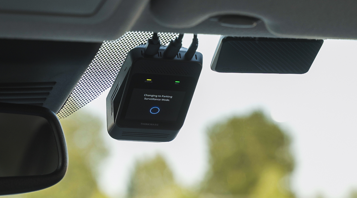 THINKWARE dash cam mounted on windshield displaying parking mode