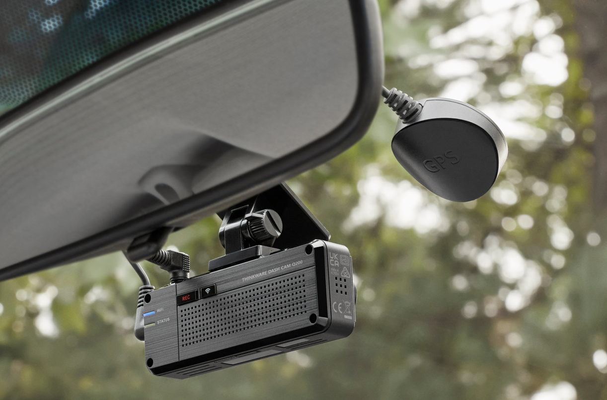 THINKWARE external GPS antenna mounted on upper windshield connected to dash cam