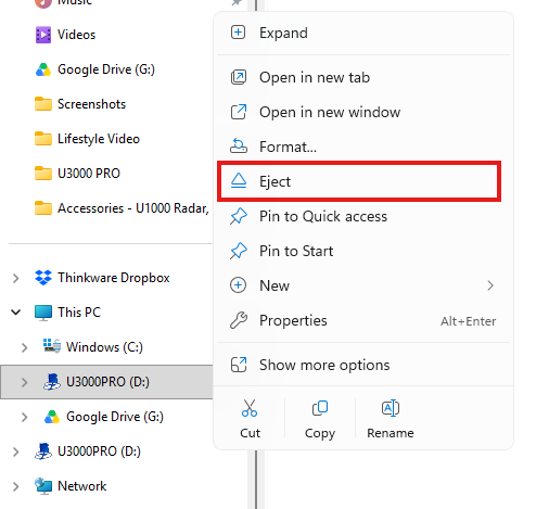 File Explorer showing the right-click menu with Eject selected for the microSD card drive