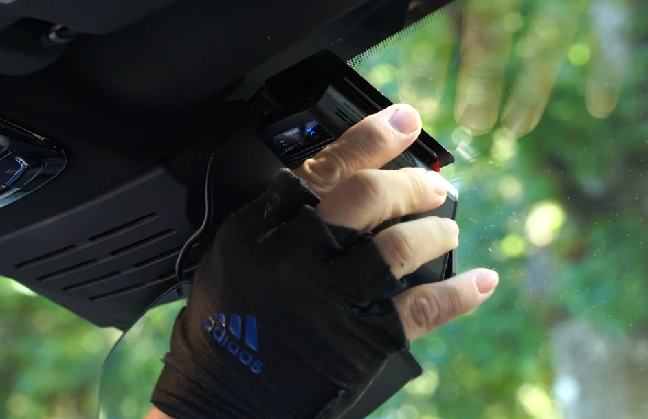 THINKWARE camera mount attached to heat-blocking film on the windshield