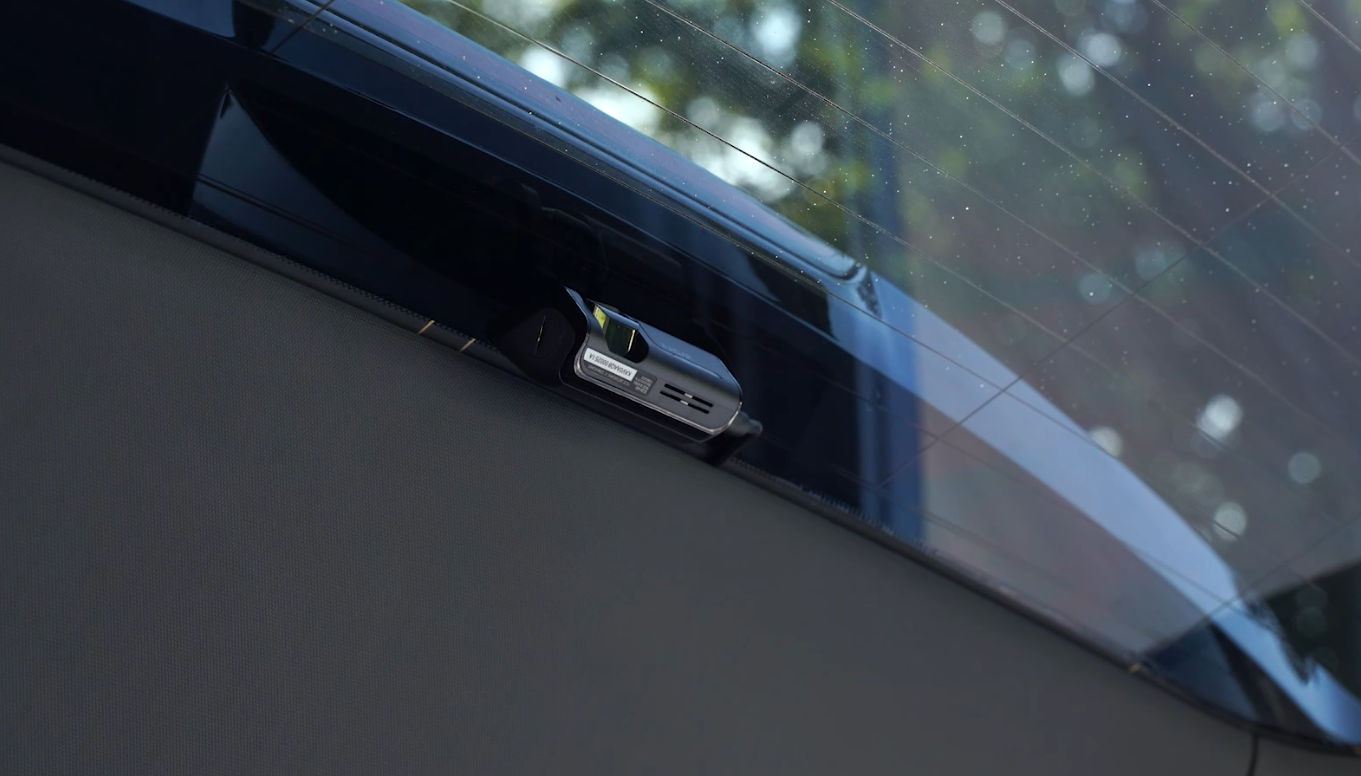 Rear dash cam mounted at the top center of the rear window