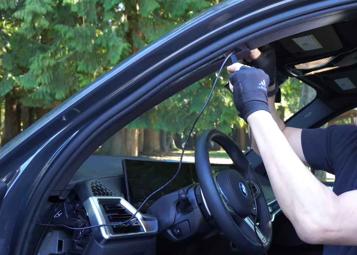 Cable routing that keeps the dash cam cable clear of the airbag deployment path