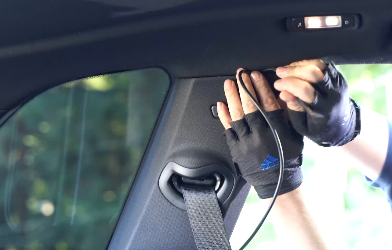 Route the rear cable along down the C-pillar or D-pillar to the rear window
